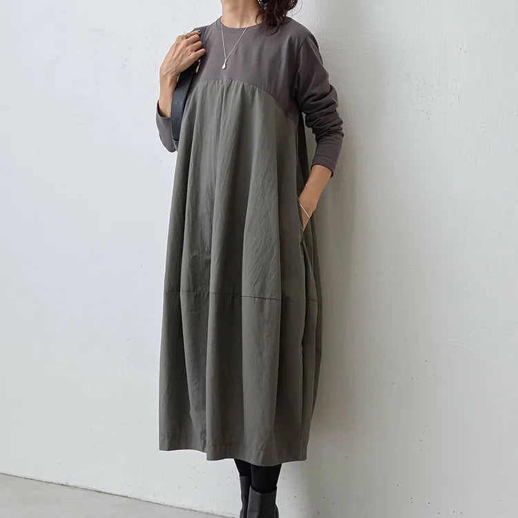 大きいサイズの長袖クルーネック切り替えワンピース。ゆったりとしたシルエットが体型をカバーし、美しさと快適さを両立！