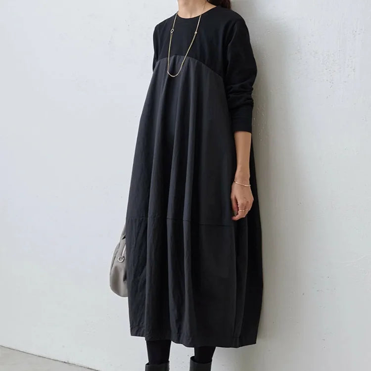 大きいサイズの長袖クルーネック切り替えワンピース。ゆったりとしたシルエットが体型をカバーし、美しさと快適さを両立！
